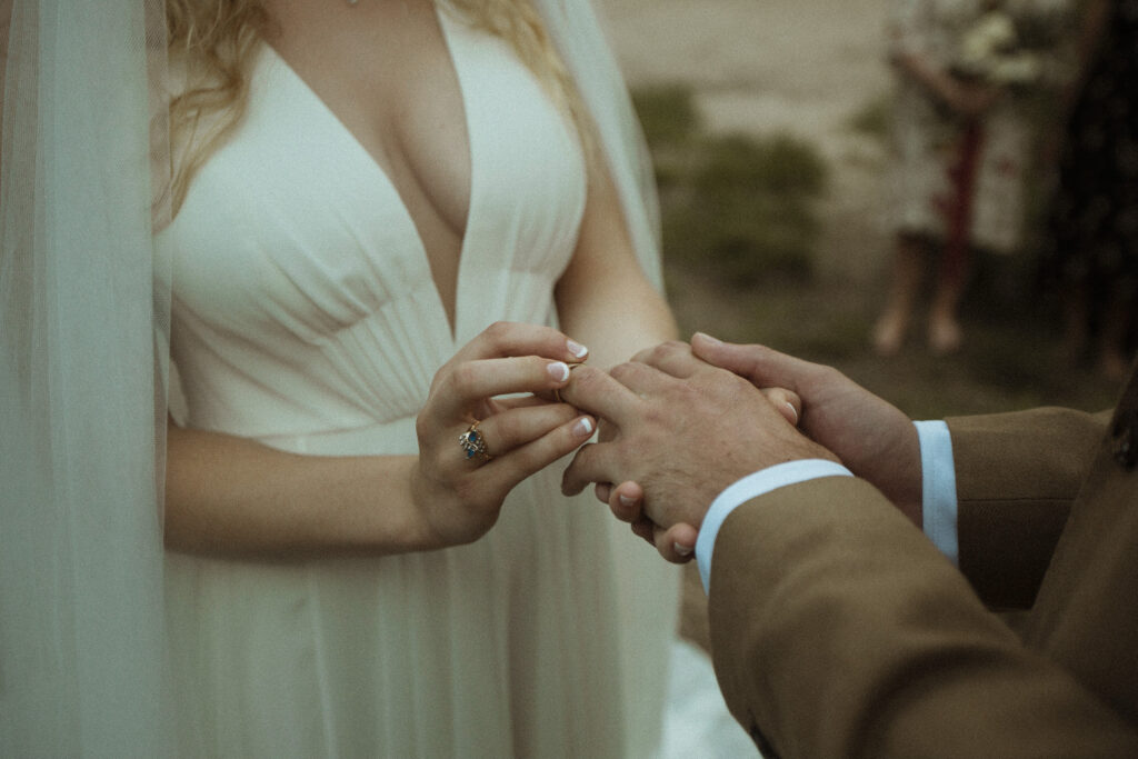 Elopement Photography, ring exchange between the bride and groom 