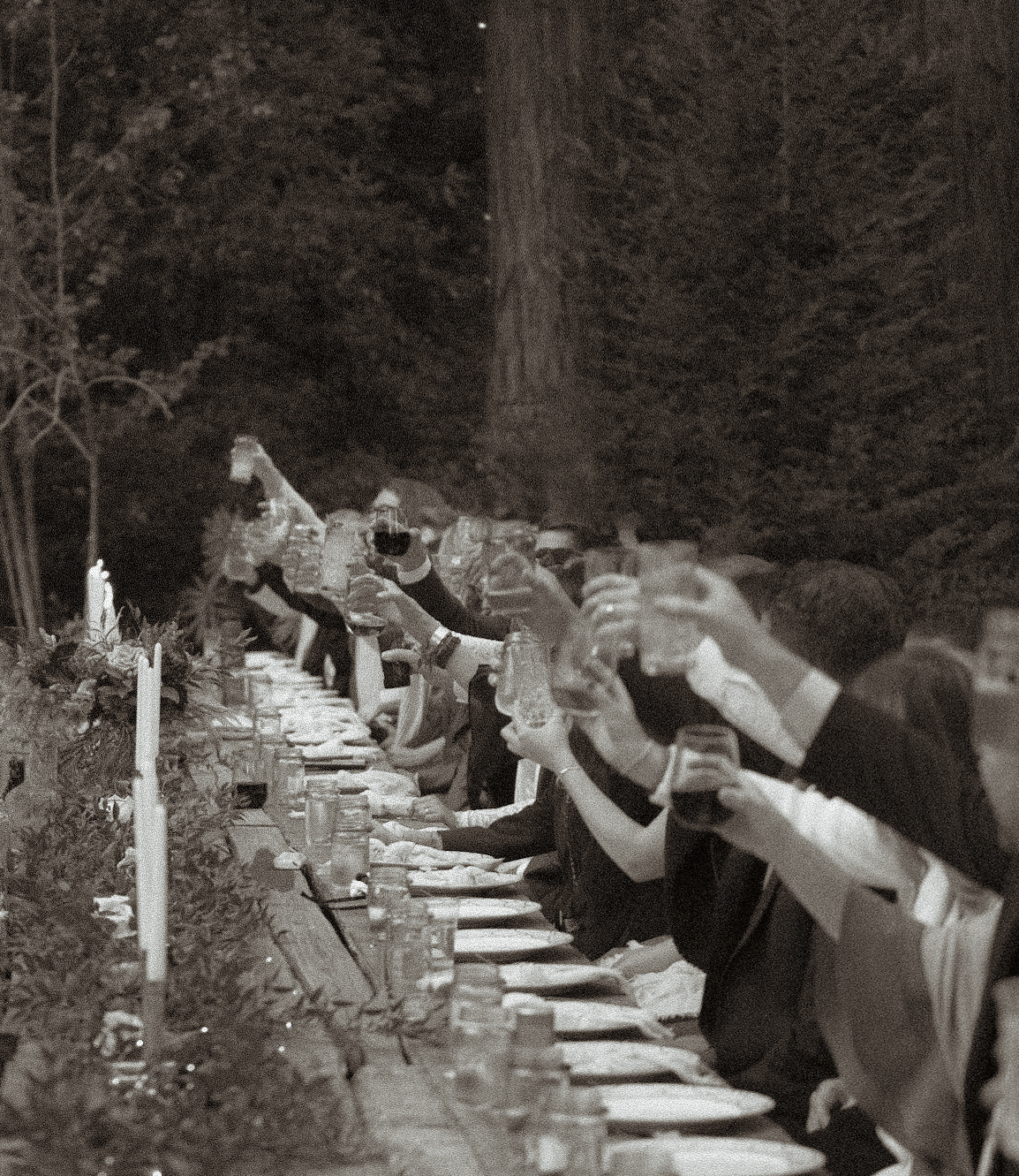 Bride and groom toasting with family and friends at their Nashville wedding