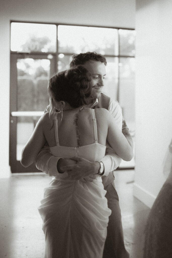 Wedding Reception at Saint Elle siblings hugging