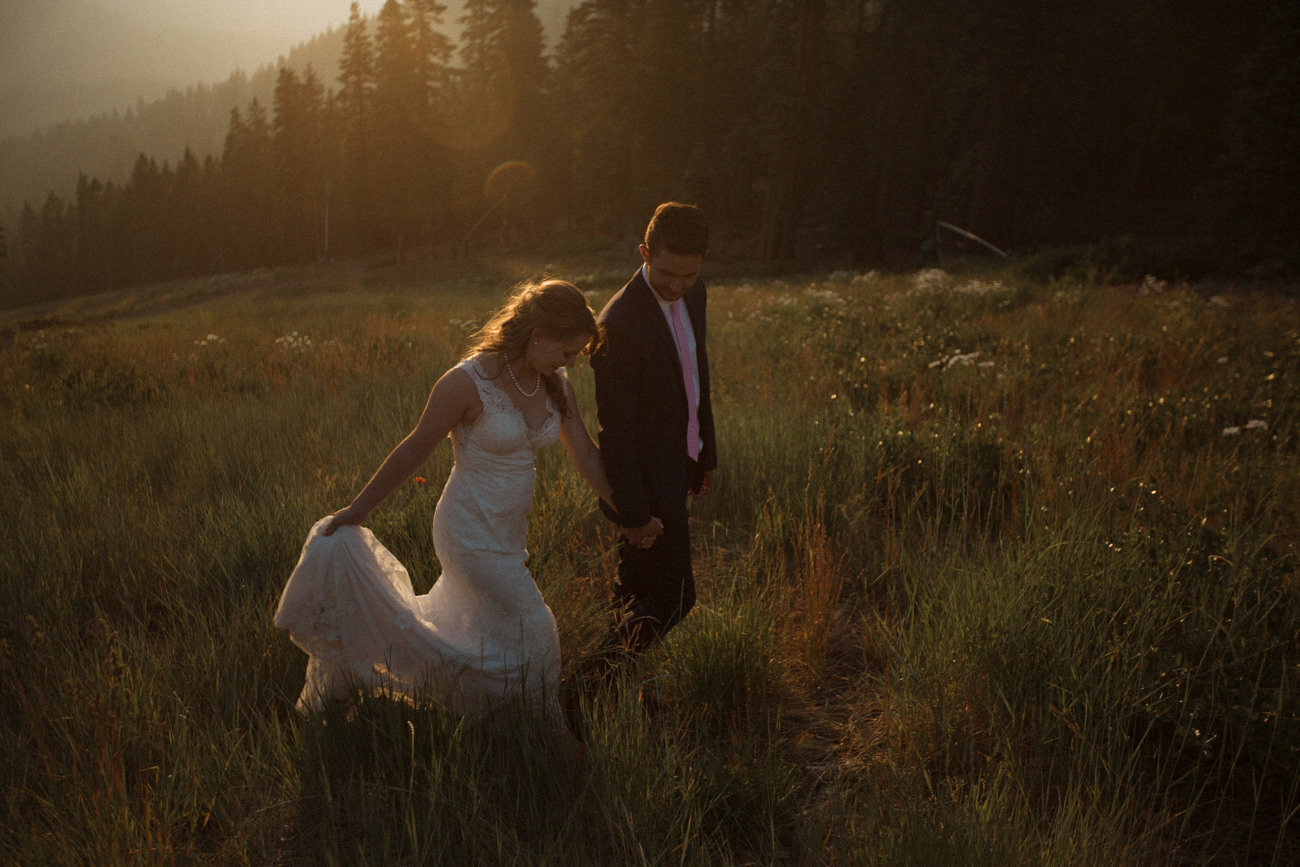 Wedding Photography, bride and groom walking during golden hour