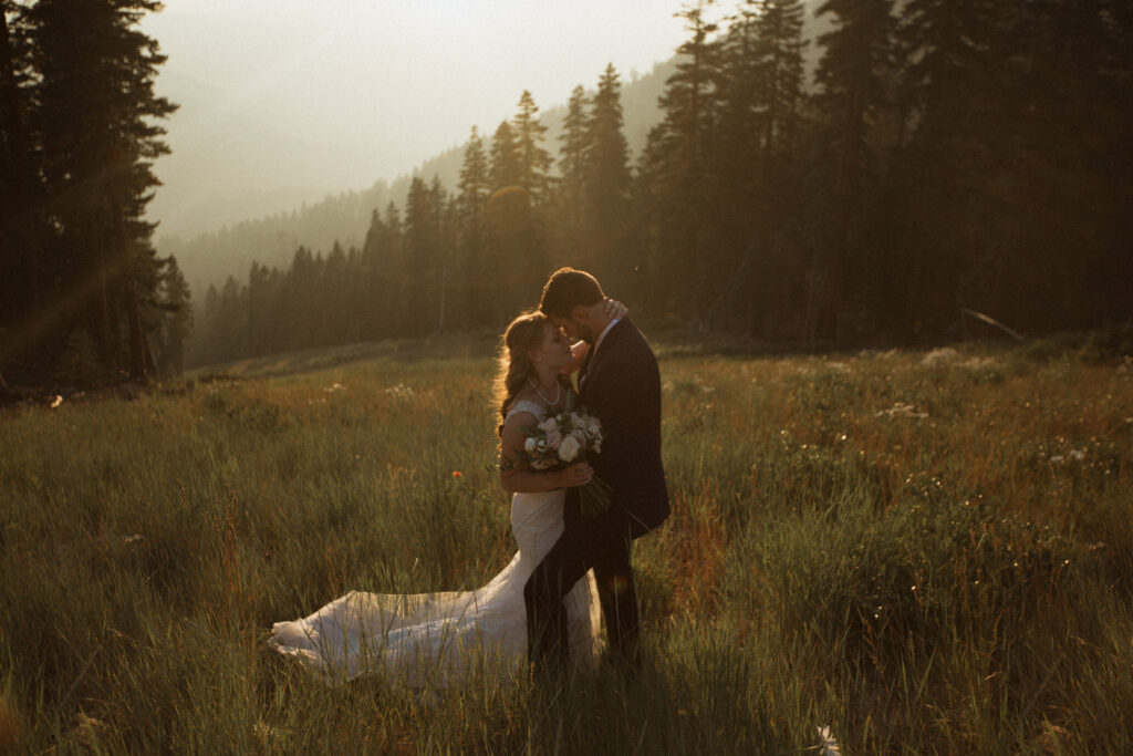 Wedding and Elopement Photography, couple walking through the woods during golden hour 